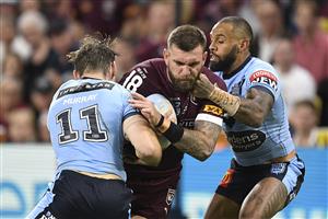 TOWNSVILLE, AUSTRALIA - JUNE 09: Kyle Feldt of the Maroons is tackled during game one of the 2021 State of Origin series between the New South Wales Blues and the Queensland Maroons at Queensland Country Bank Stadium on June 09, 2021 in Townsville, Australia. (Photo by Ian Hitchcock/Getty Images)