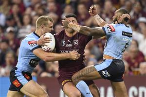 TOWNSVILLE, AUSTRALIA - JUNE 09: David Fifita of the Maroons is tackled during game one of the 2021 State of Origin series between the New South Wales Blues and the Queensland Maroons at Queensland Country Bank Stadium on June 09, 2021 in Townsville, Australia. (Photo by Ian Hitchcock/Getty Images)