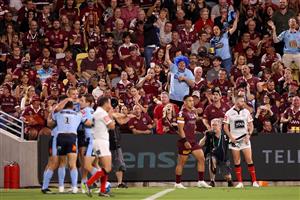 TOWNSVILLE, AUSTRALIA - JUNE 09: Blues fans celebrate after Tom Trbojevic of the Blues scores a try during game one of the 2021 State of Origin series between the New South Wales Blues and the Queensland Maroons at Queensland Country Bank Stadium on June 09, 2021 in Townsville, Australia. (Photo by Mark Kolbe/Getty Images)