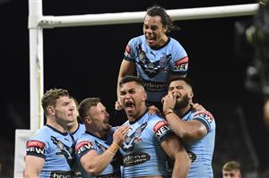 TOWNSVILLE, AUSTRALIA - JUNE 09: Daniel Saifiti of the Blues celebrates with team mates after scoring a try during game one of the 2021 State of Origin series between the New South Wales Blues and the Queensland Maroons at Queensland Country Bank Stadium on June 09, 2021 in Townsville, Australia. (Photo by Ian Hitchcock/Getty Images)