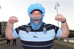 TOWNSVILLE, AUSTRALIA - JUNE 09: Blues fan Jason Davidson shows his support before the start of game one of the 2021 State of Origin series between the New South Wales Blues and the Queensland Maroons at Queensland Country Bank Stadium on June 09, 2021 in Townsville, Australia. (Photo by Ian Hitchcock/Getty Images)
