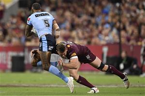 TOWNSVILLE, AUSTRALIA - JUNE 09: Josh Addo-Carr of the Blues is tackled during game one of the 2021 State of Origin series between the New South Wales Blues and the Queensland Maroons at Queensland Country Bank Stadium on June 09, 2021 in Townsville, Australia. (Photo by Ian Hitchcock/Getty Images)