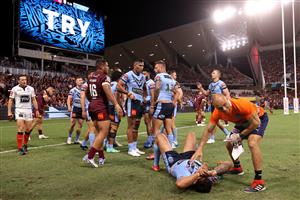 TOWNSVILLE, AUSTRALIA - JUNE 09: Latrell Mitchell of the Blues is attended to by a trainer during game one of the 2021 State of Origin series between the New South Wales Blues and the Queensland Maroons at Queensland Country Bank Stadium on June 09, 2021 in Townsville, Australia. (Photo by Mark Kolbe/Getty Images)