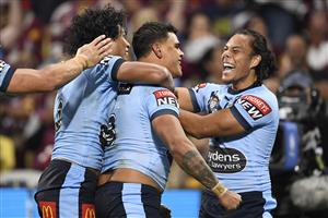 TOWNSVILLE, AUSTRALIA - JUNE 09: Latrell Mitchell of the Blues celebrates with team mates after scoring a try during game one of the 2021 State of Origin series between the New South Wales Blues and the Queensland Maroons at Queensland Country Bank Stadium on June 09, 2021 in Townsville, Australia. (Photo by Ian Hitchcock/Getty Images)
