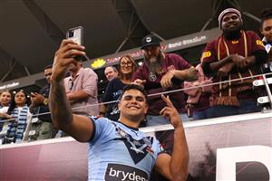TOWNSVILLE, AUSTRALIA - JUNE 09: Latrell Mitchell of the Blues poses with fans after winning game one of the 2021 State of Origin series between the New South Wales Blues and the Queensland Maroons at Queensland Country Bank Stadium on June 09, 2021 in Townsville, Australia. (Photo by Mark Kolbe/Getty Images)