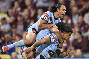 TOWNSVILLE, AUSTRALIA - JUNE 09: Latrell Mitchell of the Blues celebrates with team mates after scoring a try during game one of the 2021 State of Origin series between the New South Wales Blues and the Queensland Maroons at Queensland Country Bank Stadium on June 09, 2021 in Townsville, Australia. (Photo by Ian Hitchcock/Getty Images)