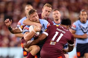 TOWNSVILLE, AUSTRALIA - JUNE 09: Tariq Sims of the Blues is tackled during game one of the 2021 State of Origin series between the New South Wales Blues and the Queensland Maroons at Queensland Country Bank Stadium on June 09, 2021 in Townsville, Australia. (Photo by Mark Kolbe/Getty Images)