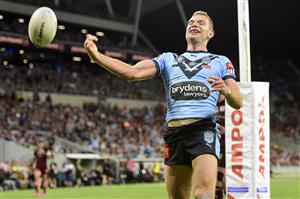 TOWNSVILLE, AUSTRALIA - JUNE 09: Tom Trbojevic of the Blues scores a try during game one of the 2021 State of Origin series between the New South Wales Blues and the Queensland Maroons at Queensland Country Bank Stadium on June 09, 2021 in Townsville, Australia. (Photo by Ian Hitchcock/Getty Images)