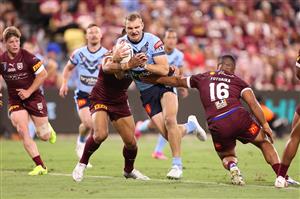 TOWNSVILLE, AUSTRALIA - JUNE 09: Tom Trbojevic of the Blues is tackled during game one of the 2021 State of Origin series between the New South Wales Blues and the Queensland Maroons at Queensland Country Bank Stadium on June 09, 2021 in Townsville, Australia. (Photo by Mark Kolbe/Getty Images)