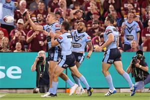 TOWNSVILLE, AUSTRALIA - JUNE 09: Tom Trbojevic of the Blues celebrates with team mates after scoring a try during game one of the 2021 State of Origin series between the New South Wales Blues and the Queensland Maroons at Queensland Country Bank Stadium on June 09, 2021 in Townsville, Australia. (Photo by Mark Kolbe/Getty Images)
