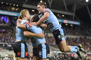 TOWNSVILLE, AUSTRALIA - JUNE 09: Tom Trbojevic of the Blues celebrates with team mates after scoring a try during game one of the 2021 State of Origin series between the New South Wales Blues and the Queensland Maroons at Queensland Country Bank Stadium on June 09, 2021 in Townsville, Australia. (Photo by Ian Hitchcock/Getty Images)