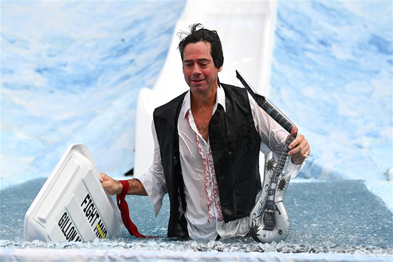 MELBOURNE, AUSTRALIA - JUNE 14: Gil McLachlan the AFL CEO goes down the slide during the Big Freeze slide at Melbourne Cricket Ground on June 14, 2021 in Melbourne, Australia. The annual event aims to raise funds to fight MND as part of the Queen's Birthday AFL match, this year held at the SCG due to Covid19 protocols in Melbourne preventing crowd from attending this year's event. (Photo by Quinn Rooney/Getty Images)