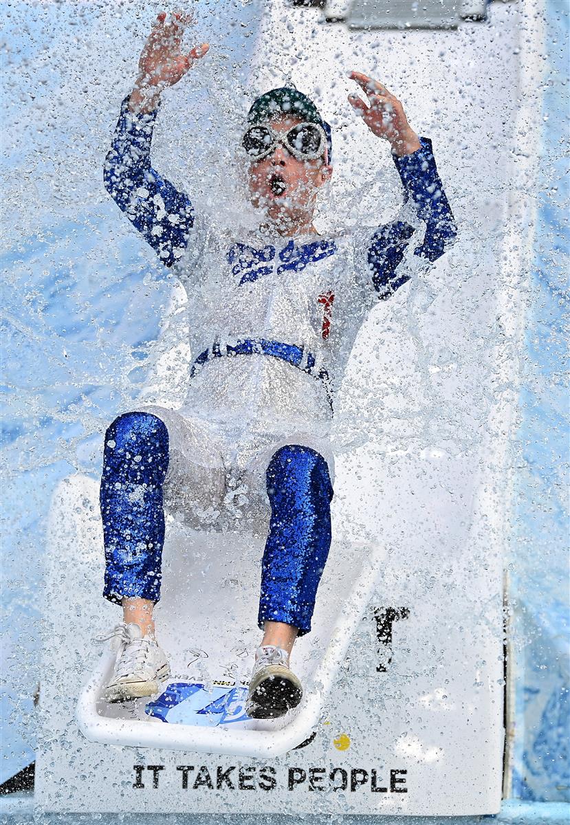 MELBOURNE, AUSTRALIA - JUNE 14: Ray Chamberlain goes down the slide during the Big Freeze slide at Melbourne Cricket Ground on June 14, 2021 in Melbourne, Australia. The annual event aims to raise funds to fight MND as part of the Queen's Birthday AFL match, this year held at the SCG due to Covid19 protocols in Melbourne preventing crowd from attending this year's event. (Photo by Quinn Rooney/Getty Images)