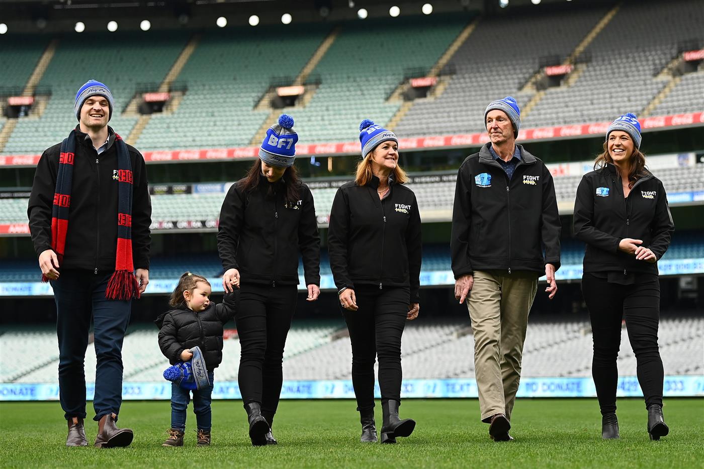 MELBOURNE, AUSTRALIA - JUNE 14: (L-R) Ben Daniher, Rosie McKenna, Lauren Daniher, Jan Daniher, Neale Daniher and Bec Daniher during the Big Freeze slide at Melbourne Cricket Ground on June 14, 2021 in Melbourne, Australia. The annual event aims to raise funds to fight MND as part of the Queen's Birthday AFL match, this year held at the SCG due to Covid19 protocols in Melbourne preventing crowd from attending this year's event. (Photo by Quinn Rooney/Getty Images)