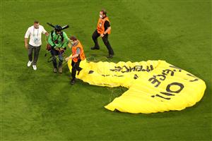 MUNICH, GERMANY - JUNE 15: A greenpeace protester and pitch invader is removed from the pitch by stewards after flying into the stadium prior to the UEFA Euro 2020 Championship Group F match between France and Germany at Football Arena Munich on June 15, 2021 in Munich, Germany. (Getty Images)