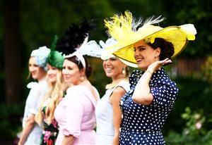 ASCOT, ENGLAND - JUNE 17: Racegoers pose for a photo on on Day Three of the Royal Ascot Meeting at Ascot Racecourse on June 17, 2021 in Ascot, England. A total of twelve thousand racegoers made up of Owners and the Public are permitted to attend the meeting due to it being an Events Research Programme (ERP) set up by the government due to the Coronavirus Pandemic. (Photo by Harry Trump/Getty Images)