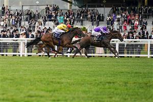 ASCOT, ENGLAND - JUNE 17: Oisin Murphy riding Perotto (R, purple) win The Britannia Stakes on Day Three of the Royal Ascot Meeting at Ascot Racecourse on June 17, 2021 in Ascot, England. A total of twelve thousand racegoers made up of owners and the public are permitted to attend the meeting due to it being an Events Research Programme (ERP) set up by the Government due to the Coronavirus pandemic. (Photo by Alan Crowhurst/Getty Images)