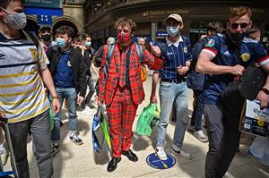 GLASGOW, SCOTLAND - JUNE 17: Scotland football supporters gather at Central Station before boarding trains to London on June 17, 2021 in Glasgow, Scotland. Officials in Scotland and London, where the match will be hosted at Wembley Stadium, have discouraged Scottish fans without tickets to the event of coming south, due to concerns about the spread of Covid-19. (Getty Images)
