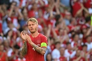 TOPSHOT - Denmark's defender Simon Kjaer claps after the ball was kicked out of play in honour of Denmark's midfielder Christian Eriksen during the UEFA EURO 2020 Group B football match between Denmark and Belgium at the Parken Stadium in Copenhagen on June 17, 2021. - Eriksen suffered a cardiac arrest during his country's Euro 2020 opener last weekend. (Getty Images)