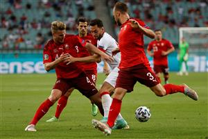Turkey's midfielder Hakan Calhanoglu (C) and Switzerland's defender Nico Elvedi (L) vie for the ball during the UEFA EURO 2020 Group A football match between Switzerland and Turkey at the Olympic Stadium in Baku on June 20, 2021. (Getty Images)