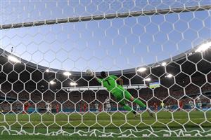 TOPSHOT - Portugal's goalkeeper Rui Patricio concedes Belgium's first goal during the UEFA EURO 2020 round of 16 football match between Belgium and Portugal at La Cartuja Stadium in Seville on June 27, 2021. (Getty Images)