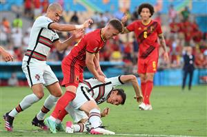 Portugal's midfielder Joao Palhinha (BOTTOM) vies with Belgium's midfielder Thorgan Hazard (C) next to Portugal's defender Pepe during the UEFA EURO 2020 round of 16 football match between Belgium and Portugal at La Cartuja Stadium in Seville on June 27, 2021. (Getty Images)