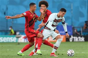 Belgium's midfielder Youri Tielemans (L) fouls Portugal's forward Cristiano Ronaldo during the UEFA EURO 2020 round of 16 football match between Belgium and Portugal at La Cartuja Stadium in Seville on June 27, 2021. (Getty Images)