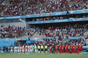 SEVILLE, SPAIN - JUNE 27: Both teams stand for the national anthem prior to the UEFA Euro 2020 Championship Round of 16 match between Belgium and Portugal at Estadio La Cartuja on June 27, 2021 in Seville, Spain. (Getty Images)