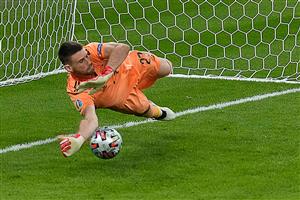 Spain's goalkeeper Unai Simon saves the ball in a penalty shootout during the UEFA EURO 2020 semi-final football match between Italy and Spain at Wembley Stadium in London on July 6, 2021. (Getty Images)