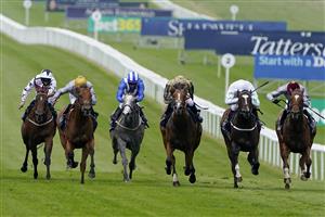 NEWMARKET, ENGLAND - JULY 08: Pat Dobbs riding Lusail (L, gold cap) win The Tattersalls July Stakes at Newmarket Racecourse on July 08, 2021 in Newmarket, England. Due to the Coronavirus pandemic, only owners along with a limited number of the paying public will be allowed to attend the meeting. (Photo by Alan Crowhurst/Getty Images)