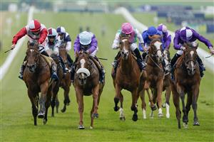 NEWMARKET, ENGLAND - JULY 08: Oisin Murphy riding Frankella (C, purple/light blue cap) win The British Stallion Studs EBF Maiden Fillies' Stakes at Newmarket Racecourse on July 08, 2021 in Newmarket, England. Due to the Coronavirus pandemic, only owners along with a limited number of the paying public will be allowed to attend the meeting. (Photo by Alan Crowhurst/Getty Images)