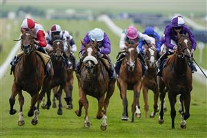 NEWMARKET, ENGLAND - JULY 08: Oisin Murphy riding Frankella (C, purple/light blue cap) win The British Stallion Studs EBF Maiden Fillies' Stakes at Newmarket Racecourse on July 08, 2021 in Newmarket, England. Due to the Coronavirus pandemic, only owners along with a limited number of the paying public will be allowed to attend the meeting. (Photo by Alan Crowhurst/Getty Images)