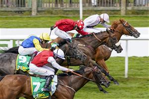 NEWMARKET, ENGLAND - JULY 08: Silvestre De Sousa riding Blackrod (red, white spotted cap) win The Each Way Extra At bet365 Handicap at Newmarket Racecourse on July 08, 2021 in Newmarket, England. Due to the Coronavirus pandemic, only owners along with a limited number of the paying public will be allowed to attend the meeting. (Photo by Alan Crowhurst/Getty Images)