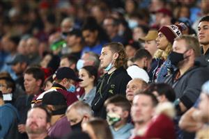 GOLD COAST, AUSTRALIA - JULY 14: Fans look on as the national anthem is sung during game three of the 2021 State of Origin Series between the New South Wales Blues and the Queensland Maroons at Cbus Super Stadium on July 14, 2021 in Gold Coast, Australia. (Photo by Chris Hyde/Getty Images)