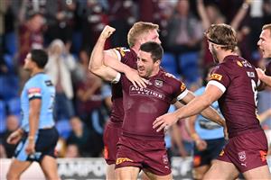 GOLD COAST, AUSTRALIA - JULY 14: Ben Hunt of the Maroons celebrates with team mates after scoring a try during game three of the 2021 State of Origin Series between the New South Wales Blues and the Queensland Maroons at Cbus Super Stadium on July 14, 2021 in Gold Coast, Australia. (Photo by Bradley Kanaris/Getty Images)