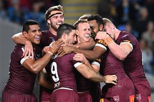 GOLD COAST, AUSTRALIA - JULY 14: Ben Hunt of the Maroons celebrates with team mates after scoring his second try during game three of the 2021 State of Origin Series between the New South Wales Blues and the Queensland Maroons at Cbus Super Stadium on July 14, 2021 in Gold Coast, Australia. (Photo by Bradley Kanaris/Getty Images)