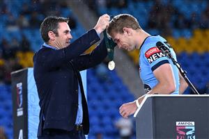 GOLD COAST, AUSTRALIA - JULY 14: Tom Trbojevic of the Blues receives the Man of the Series awards from Blues coach Brad Fittler during the trophy presentation after game three of the 2021 State of Origin Series between the New South Wales Blues and the Queensland Maroons at Cbus Super Stadium on July 14, 2021 in Gold Coast, Australia. (Photo by Bradley Kanaris/Getty Images)