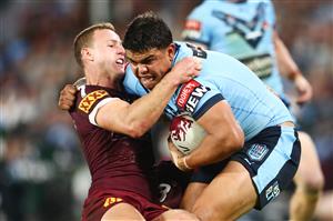 GOLD COAST, AUSTRALIA - JULY 14: Latrell Mitchell of the Blues is tackled by Daly Cherry-Evans of the Maroons during game three of the 2021 State of Origin Series between the New South Wales Blues and the Queensland Maroons at Cbus Super Stadium on July 14, 2021 in Gold Coast, Australia. (Photo by Chris Hyde/Getty Images)