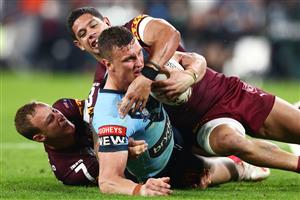 GOLD COAST, AUSTRALIA - JULY 14: Jack Wighton of the Blues is tackled during game three of the 2021 State of Origin Series between the New South Wales Blues and the Queensland Maroons at Cbus Super Stadium on July 14, 2021 in Gold Coast, Australia. (Photo by Chris Hyde/Getty Images)