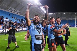 GOLD COAST, AUSTRALIA - JULY 14: Josh Addo-Carr of the Blues holds aloft the Origin trophy after winning the series 2-1 after game three of the 2021 State of Origin Series between the New South Wales Blues and the Queensland Maroons at Cbus Super Stadium on July 14, 2021 in Gold Coast, Australia. (Photo by Bradley Kanaris/Getty Images)