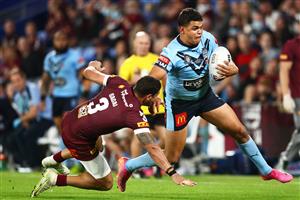GOLD COAST, AUSTRALIA - JULY 14: Latrell Mitchell of the Blues puts a fend on Dane Gagai of the Maroons during game three of the 2021 State of Origin Series between the New South Wales Blues and the Queensland Maroons at Cbus Super Stadium on July 14, 2021 in Gold Coast, Australia. (Photo by Chris Hyde/Getty Images)