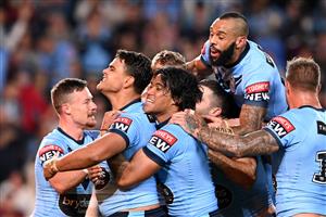 GOLD COAST, AUSTRALIA - JULY 14: Latrell Mitchell of the Blues celebrates with team mates after scoring a try during game three of the 2021 State of Origin Series between the New South Wales Blues and the Queensland Maroons at Cbus Super Stadium on July 14, 2021 in Gold Coast, Australia. (Photo by Bradley Kanaris/Getty Images)