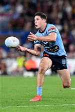 GOLD COAST, AUSTRALIA - JULY 14: Mitchell Moses of the Blues offloads the ball during game three of the 2021 State of Origin Series between the New South Wales Blues and the Queensland Maroons at Cbus Super Stadium on July 14, 2021 in Gold Coast, Australia. (Photo by Bradley Kanaris/Getty Images)