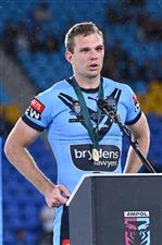 GOLD COAST, AUSTRALIA - JULY 14: Tom Trbojevic of the Blues talks during the trophy presentation after game three of the 2021 State of Origin Series between the New South Wales Blues and the Queensland Maroons at Cbus Super Stadium on July 14, 2021 in Gold Coast, Australia. (Photo by Bradley Kanaris/Getty Images)