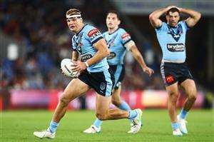 GOLD COAST, AUSTRALIA - JULY 14: Tom Trbojevic of the Blues makes a break during game three of the 2021 State of Origin Series between the New South Wales Blues and the Queensland Maroons at Cbus Super Stadium on July 14, 2021 in Gold Coast, Australia. (Photo by Chris Hyde/Getty Images)