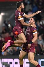GOLD COAST, AUSTRALIA - JULY 14: Hamiso Tabuai-Fidow of the Maroons celebrates with Valentine Holmes of the Maroons after scoring a try during game three of the 2021 State of Origin Series between the New South Wales Blues and the Queensland Maroons at Cbus Super Stadium on July 14, 2021 in Gold Coast, Australia. (Photo by Bradley Kanaris/Getty Images)