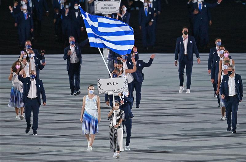 Greece's flag bearer Anna Korakaki and Greece's flag bearer Eleftherios Petrounias and their delegation enter the Olympic Stadium during the opening ceremony of the Tokyo 2020 Olympic Games, in Tokyo, on July 23, 2021. (Getty Images)