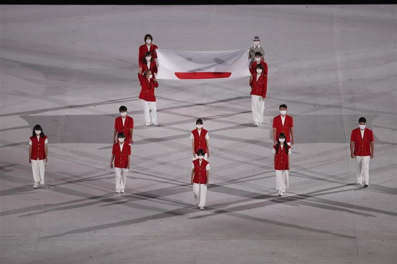 TOKYO, JAPAN - JULY 23: The Japanese National Flag is brought onto the stage during the Opening Ceremony of the Tokyo 2020 Olympic Games at Olympic Stadium on July 23, 2021 in Tokyo, Japan. (Getty Images)