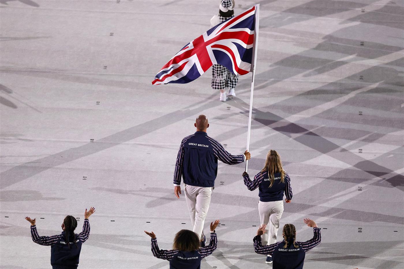 TOKYO, JAPAN - JULY 23: Flag bearers Hannah Mills and Mohamed Sbihi of Team Great Britain lead their team during the Opening Ceremony of the Tokyo 2020 Olympic Games at Olympic Stadium on July 23, 2021 in Tokyo, Japan. (Getty Images)