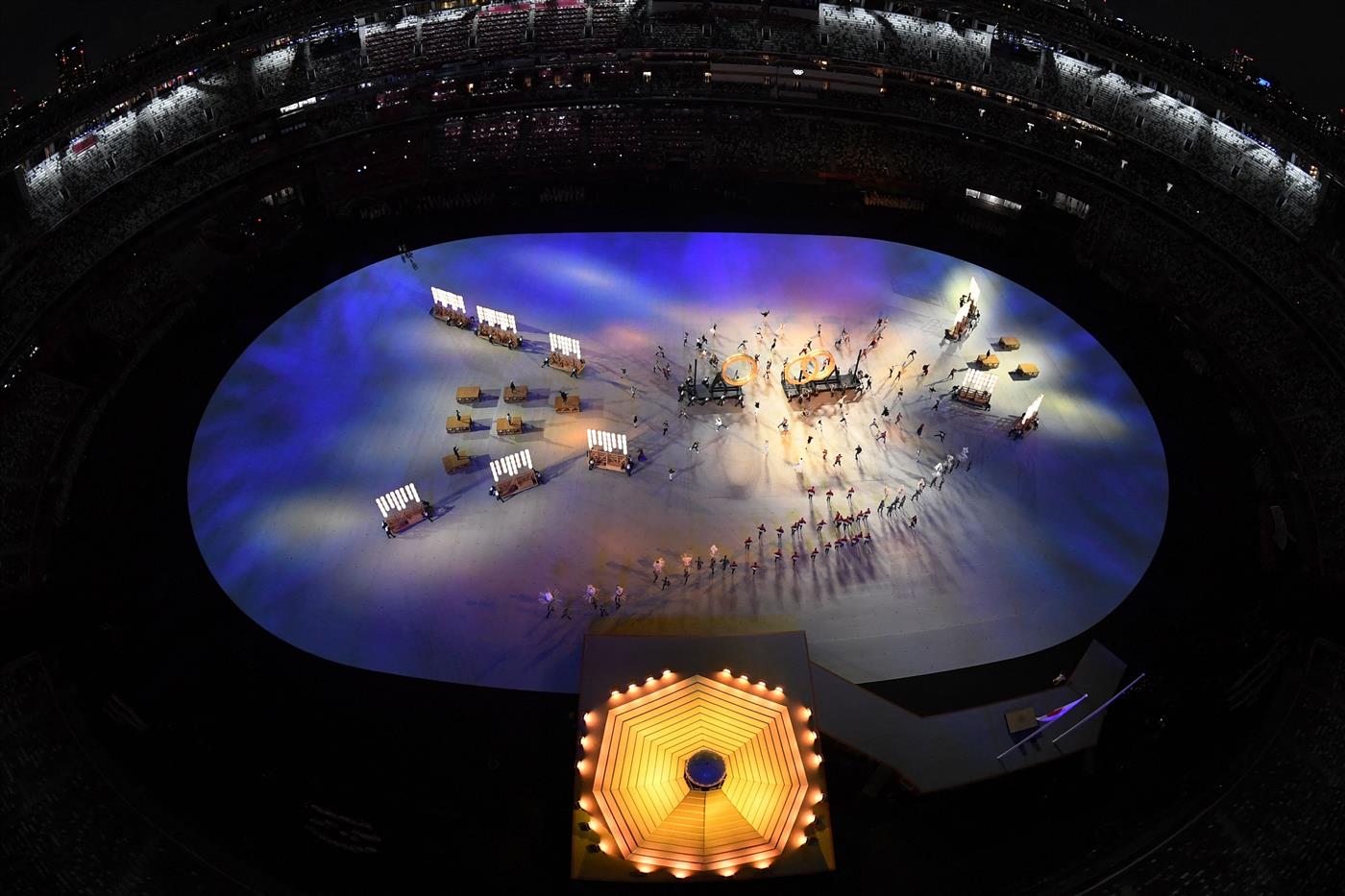 An overview shows performers assembling the Olympic Rings during the opening ceremony of the Tokyo 2020 Olympic Games, at the Olympic Stadium, in Tokyo, on July 23, 2021. (Getty Images)
